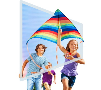Three children running with a kite